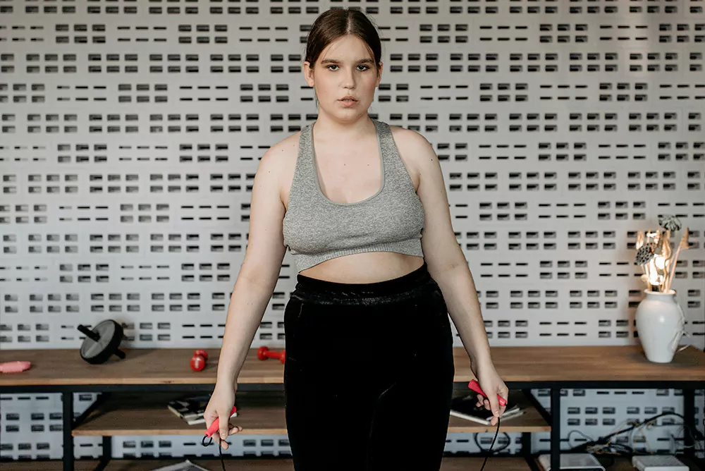 woman exercising with a jump rope for weight loss
