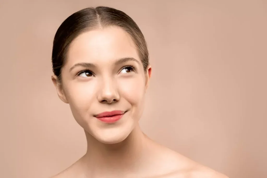 Close-up of a woman with clear skin, highlighting the skin benefits of glutathione injections and antioxidant therapy
