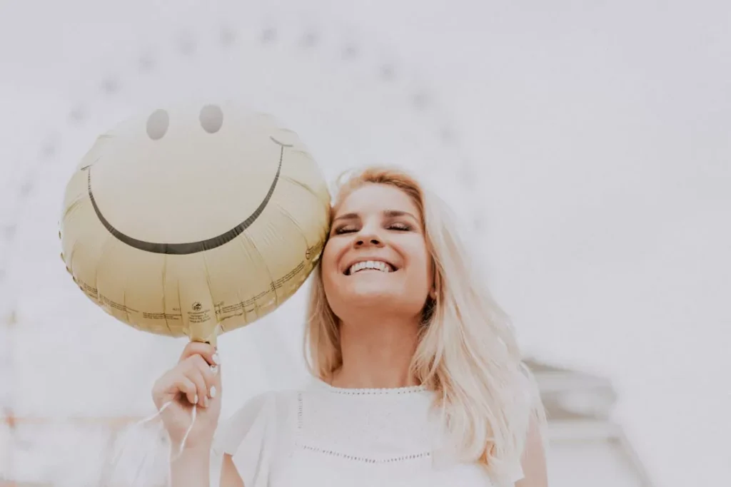 Smiling woman symbolizing improved mood, energy, and vitality through NAD+ support