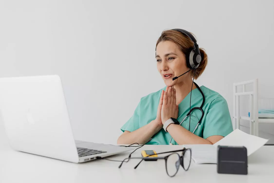 doctor speaking with patient through online telehealth consultation