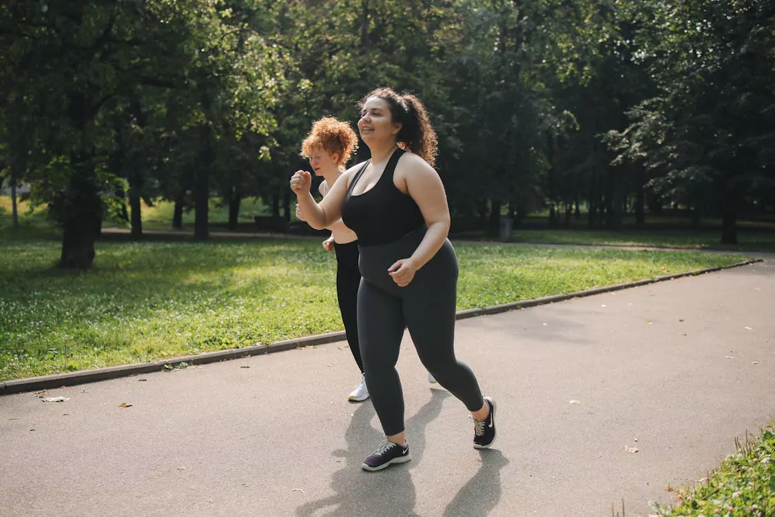 Women jogging outdoors, representing a healthy lifestyle and weight loss support during a semaglutide online program.