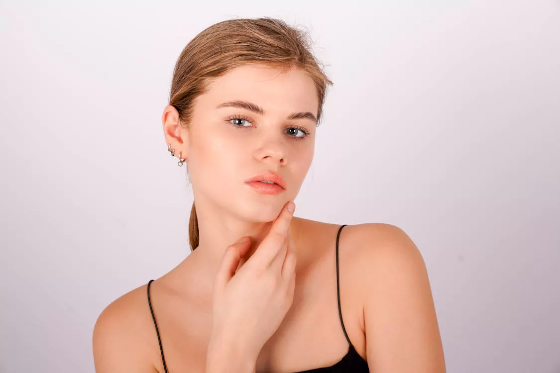 woman with clear, glowing skin representing vitamin B12 skin benefits
