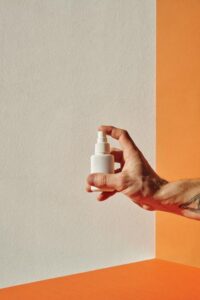 Hand holding a nasal spray bottle representing ketamine nasal spray treatment and pricing considerations
