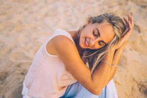 Woman relaxing outdoors representing healthy aging and cellular wellness