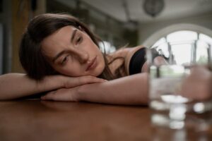 woman reflecting on mental health treatment options in a supervised ketamine therapy setting