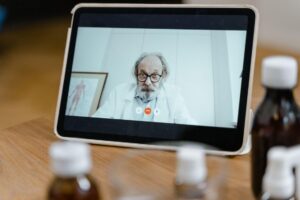 patient attending a telehealth consultation with a healthcare provider on a tablet for remote mental health care