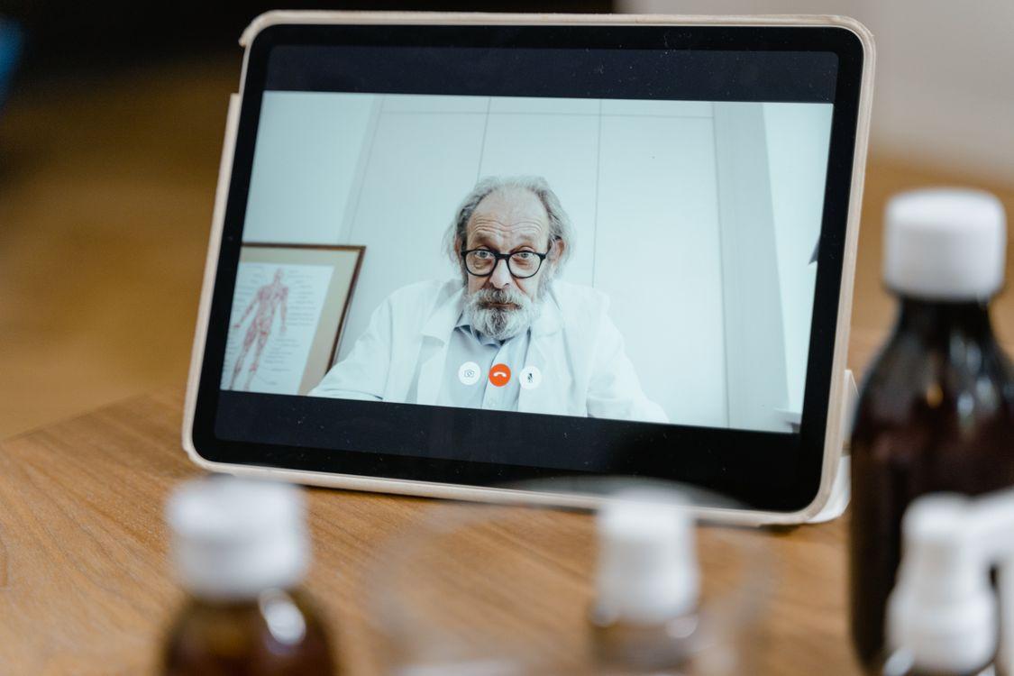 patient attending a telehealth consultation with a healthcare provider on a tablet for remote mental health care