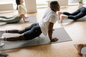 man stretching during a wellness routine representing coordinated NAD, glutathione, and peptide protocols