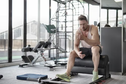 Athlete resting after a workout during muscle and tissue recovery