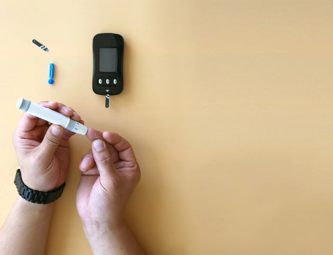 A person using a blood glucose meter - Daytryp RX A person using a blood glucose meter