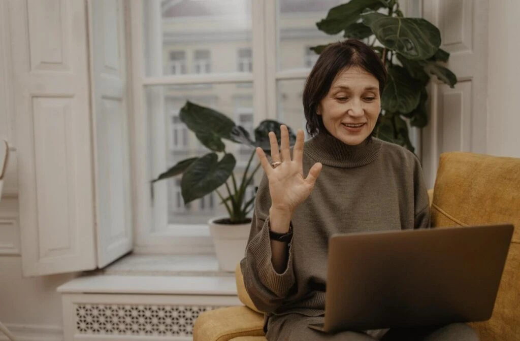 A woman consulting with a licensed hair health specialist via video call