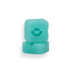 Two stacked turquoise lozenges with a circular logo, representing wellness supplements or edibles.