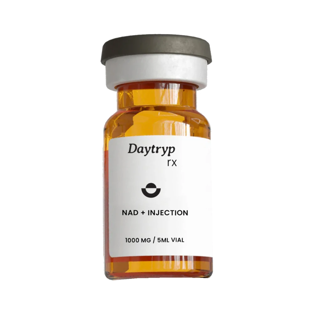 A clear glass vial with a dark gray and white cap and a label that reads "Daytryp rx NAD + INJECTION 1000 MG / 5ML VIAL".