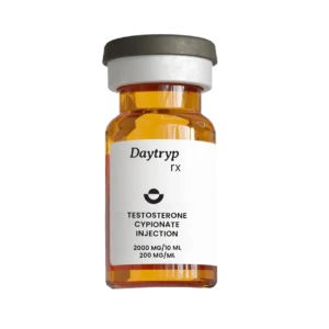 A clear glass vial with a dark gray and white cap and a label that reads "Daytryp rx TESTOSTERONE CYPIONATE INJECTION 2000 MG/10 ML 200 MG/ML".
